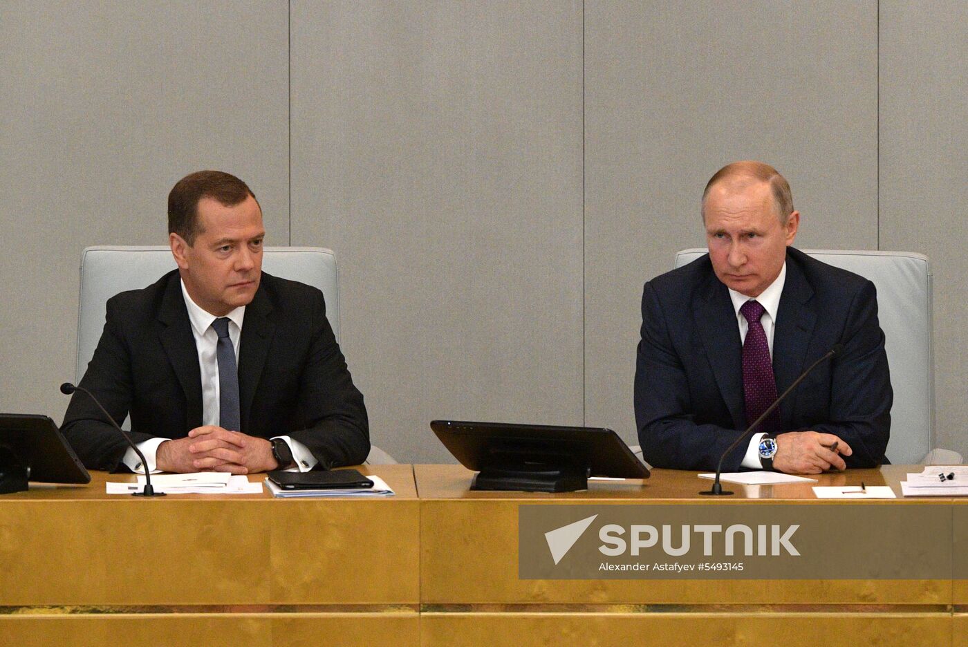 Russian President Vladimir Putin and candidate for Prime Minister Dmitry Medvedev attend State Duma plenary meeting