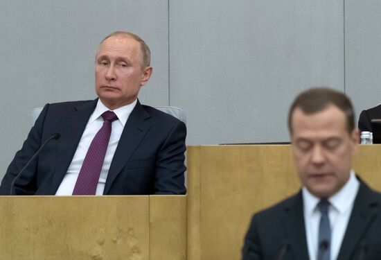 Russian President Vladimir Putin and candidate for Prime Minister Dmitry Medvedev attend State Duma plenary meeting