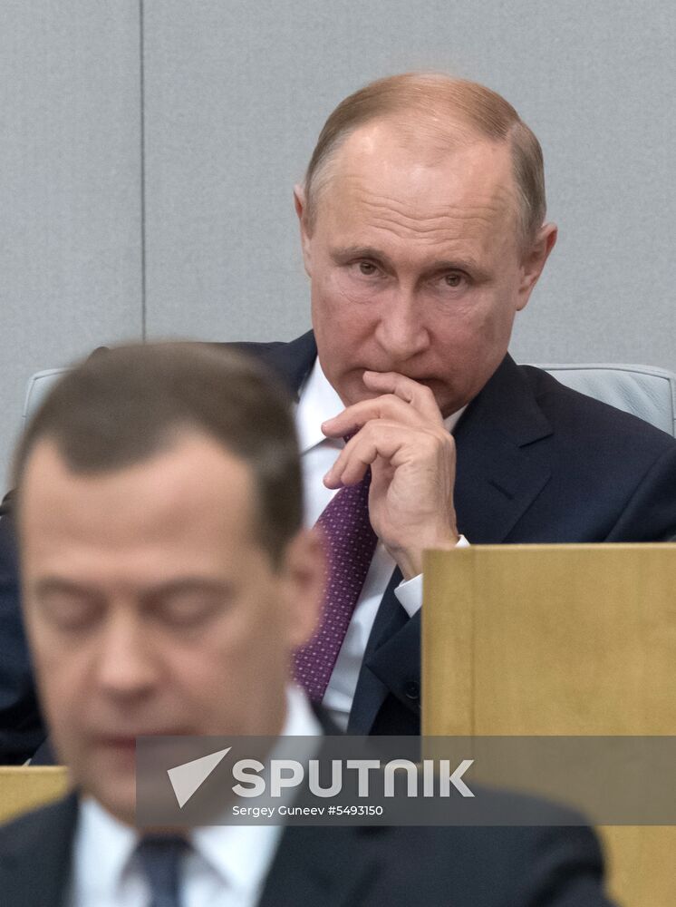 Russian President Vladimir Putin and candidate for Prime Minister Dmitry Medvedev attend State Duma plenary meeting