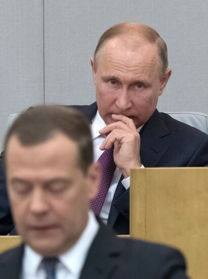 Russian President Vladimir Putin and candidate for Prime Minister Dmitry Medvedev attend State Duma plenary meeting