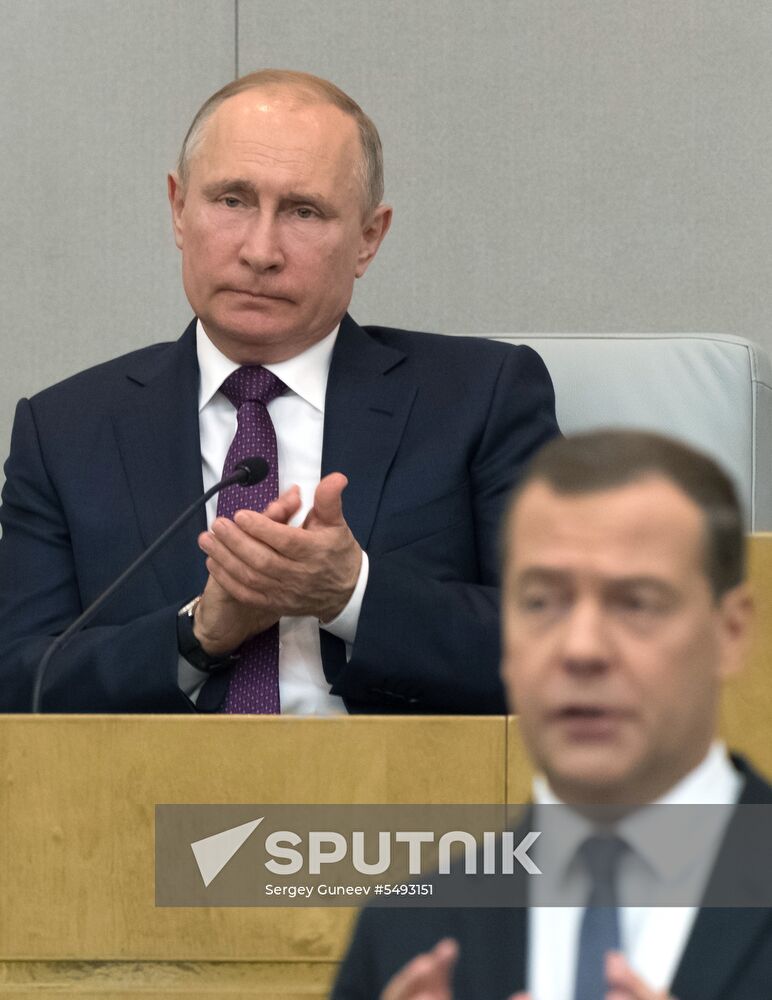 Russian President Vladimir Putin and candidate for Prime Minister Dmitry Medvedev attend State Duma plenary meeting