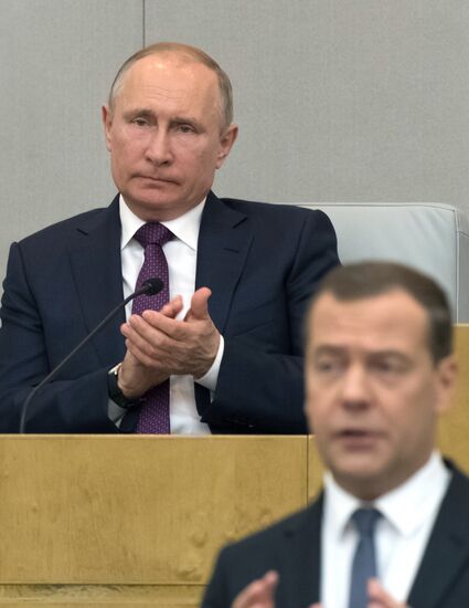 Russian President Vladimir Putin and candidate for Prime Minister Dmitry Medvedev attend State Duma plenary meeting