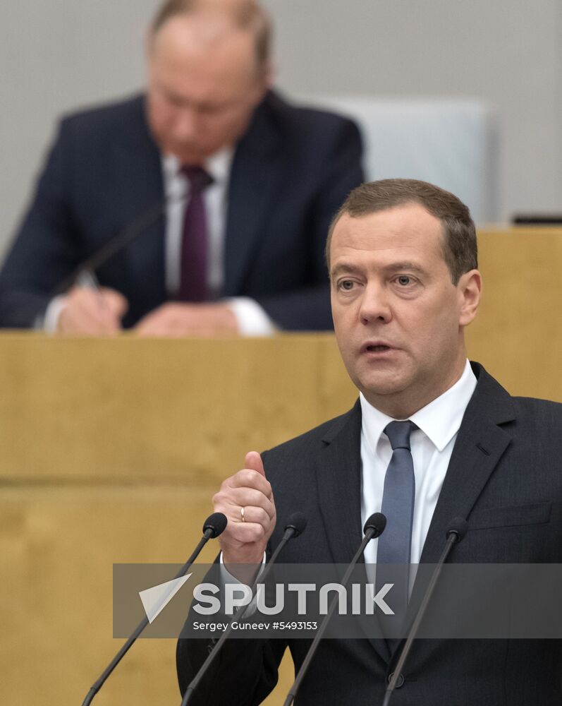 Russian President Vladimir Putin and candidate for Prime Minister Dmitry Medvedev attend State Duma plenary meeting