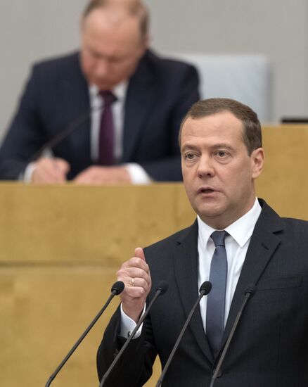 Russian President Vladimir Putin and candidate for Prime Minister Dmitry Medvedev attend State Duma plenary meeting