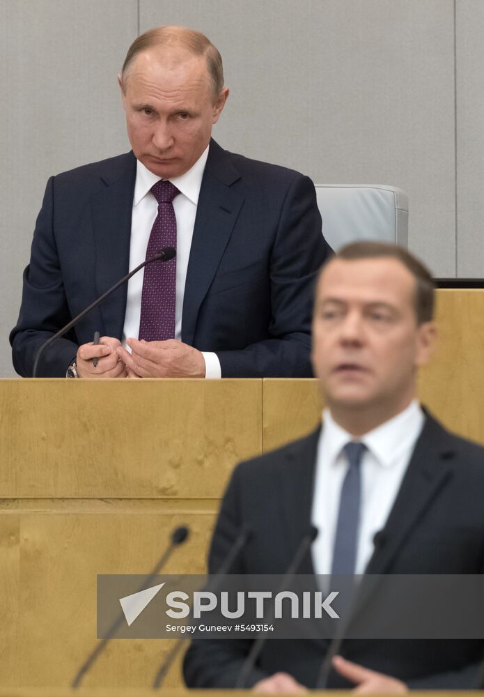 Russian President Vladimir Putin and candidate for Prime Minister Dmitry Medvedev attend State Duma plenary meeting