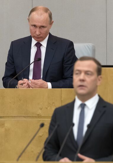 Russian President Vladimir Putin and candidate for Prime Minister Dmitry Medvedev attend State Duma plenary meeting