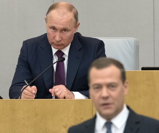 Russian President Vladimir Putin and candidate for Prime Minister Dmitry Medvedev attend State Duma plenary meeting