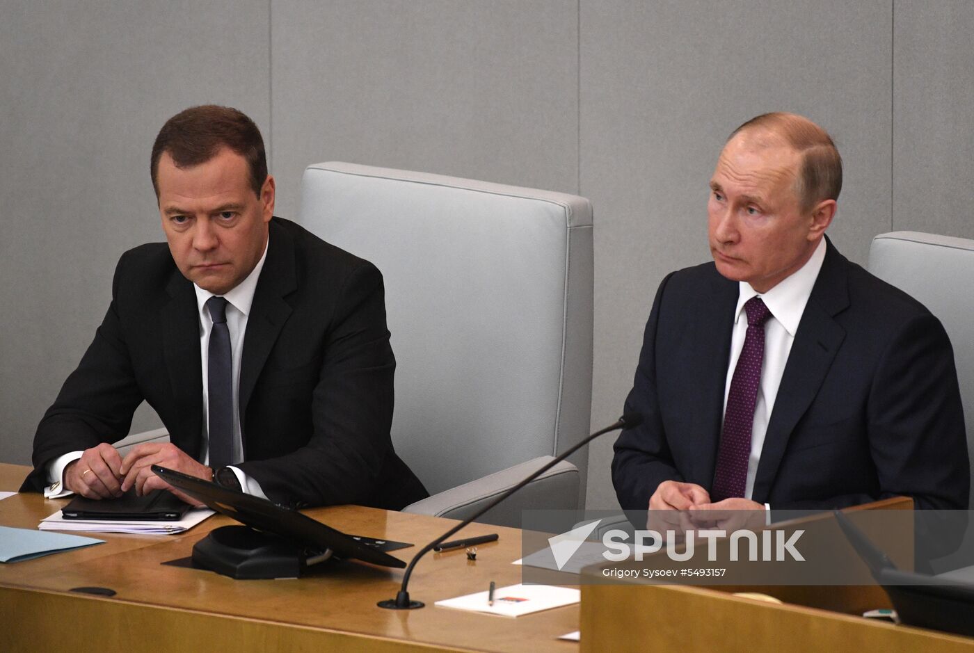 Russian President Vladimir Putin and candidate for Prime Minister Dmitry Medvedev attend State Duma plenary meeting