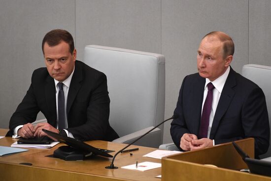 Russian President Vladimir Putin and candidate for Prime Minister Dmitry Medvedev attend State Duma plenary meeting