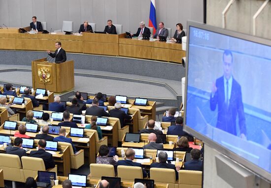 Russian President Vladimir Putin and candidate for Prime Minister Dmitry Medvedev attend State Duma plenary meeting