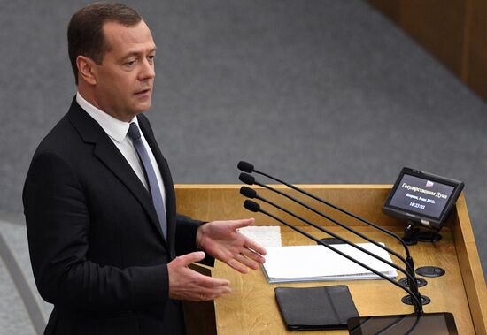 Russian President Vladimir Putin and candidate for Prime Minister Dmitry Medvedev attend State Duma plenary meeting