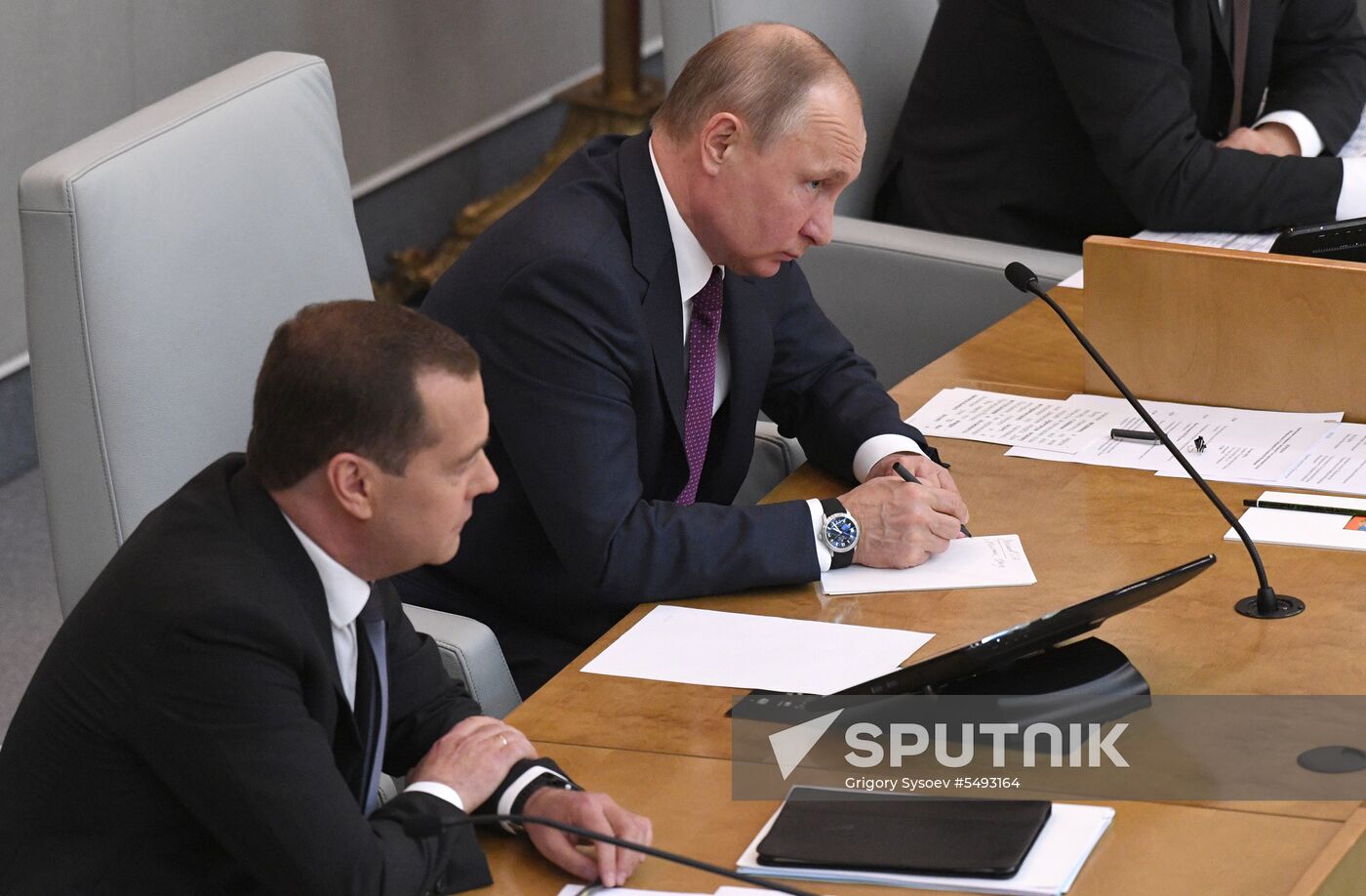 Russian President Vladimir Putin and candidate for Prime Minister Dmitry Medvedev attend State Duma plenary meeting