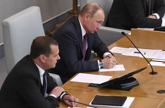 Russian President Vladimir Putin and candidate for Prime Minister Dmitry Medvedev attend State Duma plenary meeting