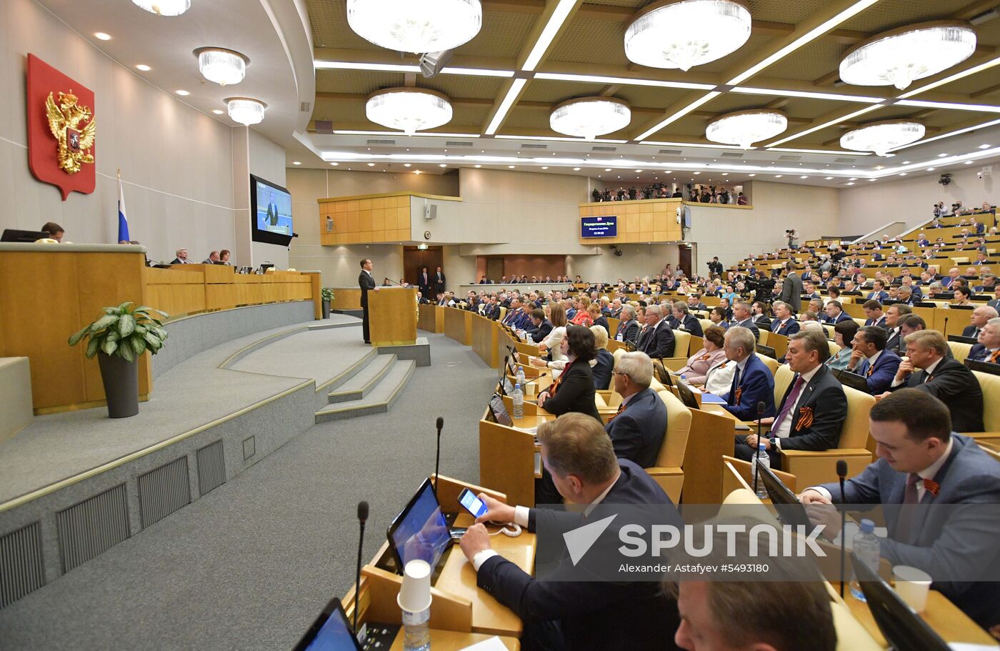 Russian President Vladimir Putin and candidate for Prime Minister Dmitry Medvedev attend State Duma plenary meeting