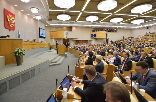 Russian President Vladimir Putin and candidate for Prime Minister Dmitry Medvedev attend State Duma plenary meeting