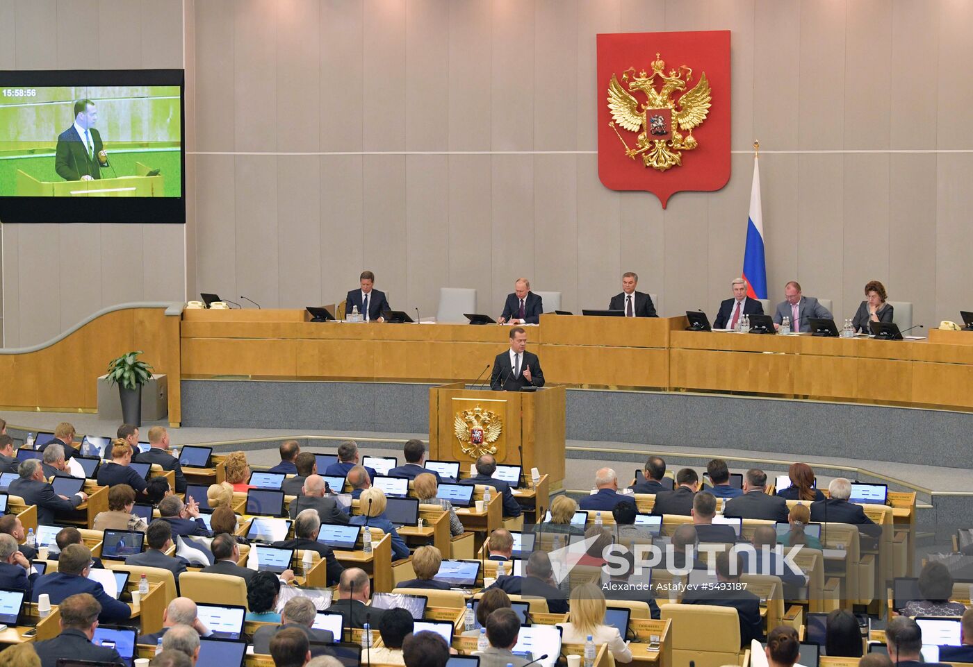 Russian President Vladimir Putin and candidate for Prime Minister Dmitry Medvedev attend State Duma plenary meeting