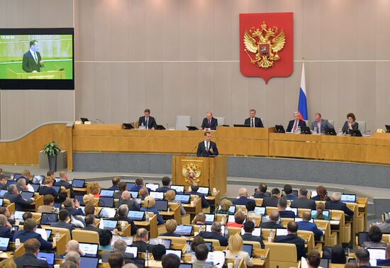 Russian President Vladimir Putin and candidate for Prime Minister Dmitry Medvedev attend State Duma plenary meeting