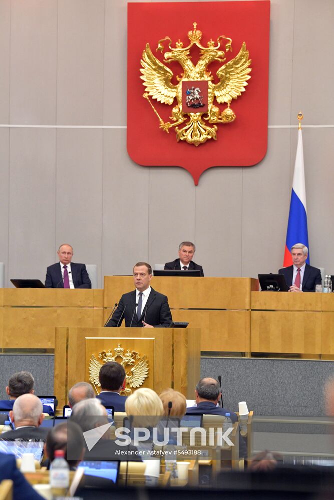 Russian President Vladimir Putin and candidate for Prime Minister Dmitry Medvedev attend State Duma plenary meeting