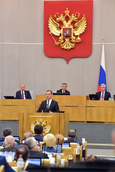 Russian President Vladimir Putin and candidate for Prime Minister Dmitry Medvedev attend State Duma plenary meeting