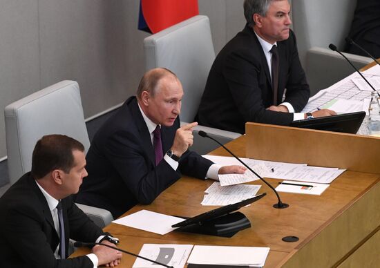 Russian President Vladimir Putin and candidate for Prime Minister Dmitry Medvedev attend State Duma plenary meeting