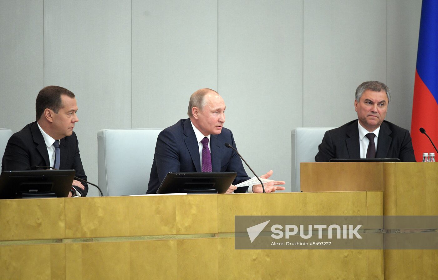 Russian President Vladimir Putin and candidate for Prime Minister Dmitry Medvedev attend State Duma plenary meeting