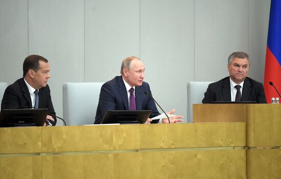 Russian President Vladimir Putin and candidate for Prime Minister Dmitry Medvedev attend State Duma plenary meeting