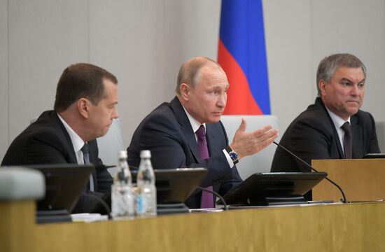 Russian President Vladimir Putin and candidate for Prime Minister Dmitry Medvedev attend State Duma plenary meeting