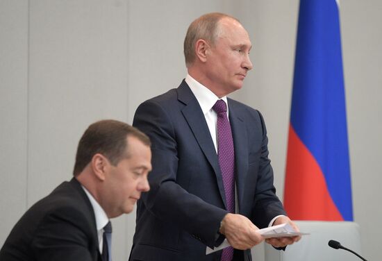 Russian President Vladimir Putin and candidate for Prime Minister Dmitry Medvedev attend State Duma plenary meeting