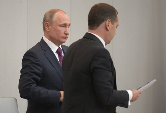 Russian President Vladimir Putin and candidate for Prime Minister Dmitry Medvedev attend State Duma plenary meeting