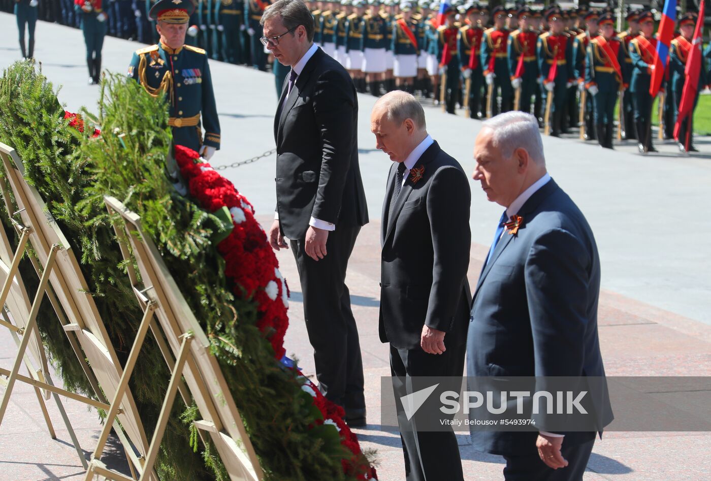 President Vladimir Putin and Prime Minister Dmitry Medvedev at wreath-laying ceremony at Unknown Soldiers' Tomb