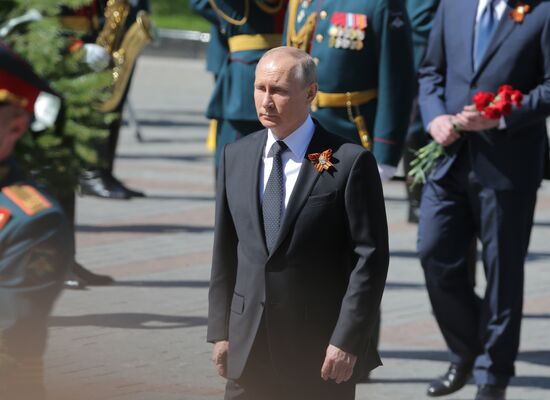 President Vladimir Putin and Prime Minister Dmitry Medvedev at wreath-laying ceremony at Unknown Soldiers' Tomb