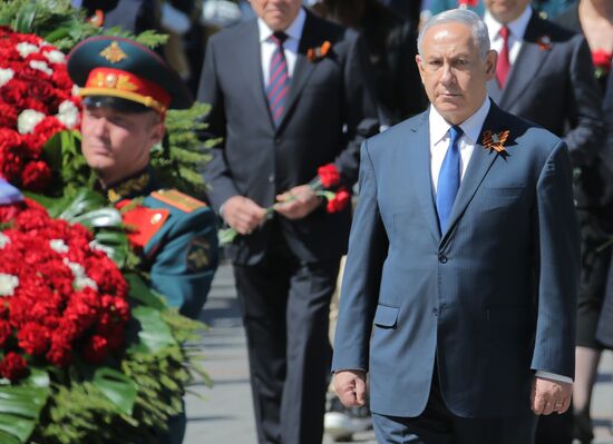 President Vladimir Putin and Prime Minister Dmitry Medvedev at wreath-laying ceremony at Unknown Soldiers' Tomb
