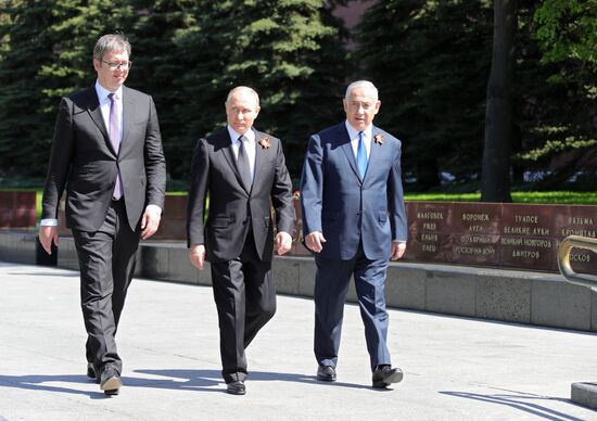 President Vladimir Putin and Prime Minister Dmitry Medvedev at wreath-laying ceremony at Unknown Soldiers' Tomb