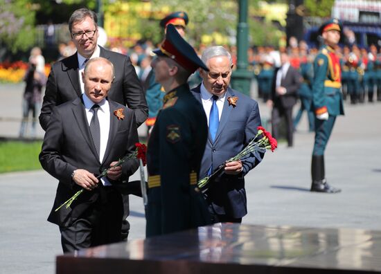 President Vladimir Putin and Prime Minister Dmitry Medvedev at wreath-laying ceremony at Unknown Soldiers' Tomb