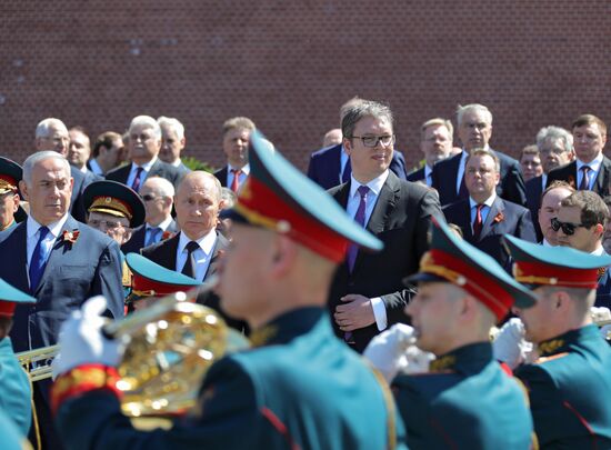 President Vladimir Putin and Prime Minister Dmitry Medvedev at wreath-laying ceremony at Unknown Soldiers' Tomb