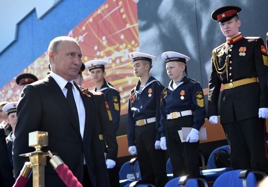 President Vladimir Putin and Prime Minister Dmitry Medvedev at military parade to mark 73rd anniversary of Victory in Great Patriotic War