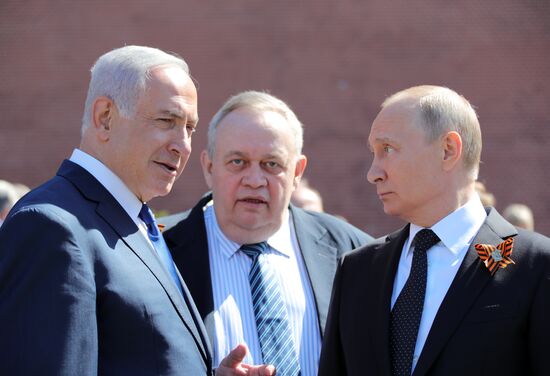 President Vladimir Putin and Prime Minister Dmitry Medvedev at wreath-laying ceremony at Unknown Soldiers' Tomb