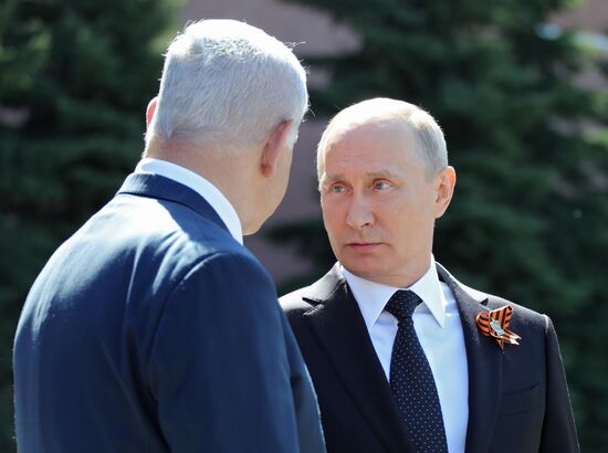 President Vladimir Putin and Prime Minister Dmitry Medvedev at wreath-laying ceremony at Unknown Soldiers' Tomb