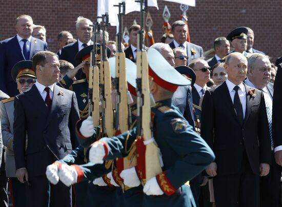 President Vladimir Putin and Prime Minister Dmitry Medvedev at wreath-laying ceremony at Unknown Soldiers' Tomb
