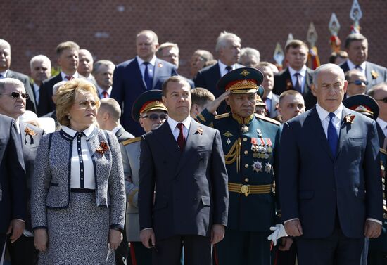 President Vladimir Putin and Prime Minister Dmitry Medvedev at wreath-laying ceremony at Unknown Soldiers' Tomb