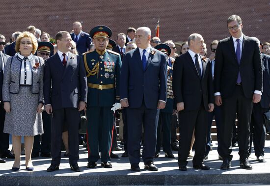 President Vladimir Putin and Prime Minister Dmitry Medvedev at wreath-laying ceremony at Unknown Soldiers' Tomb