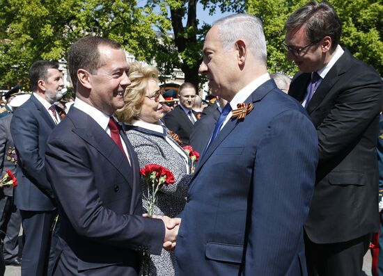 President Vladimir Putin and Prime Minister Dmitry Medvedev at wreath-laying ceremony at Unknown Soldiers' Tomb