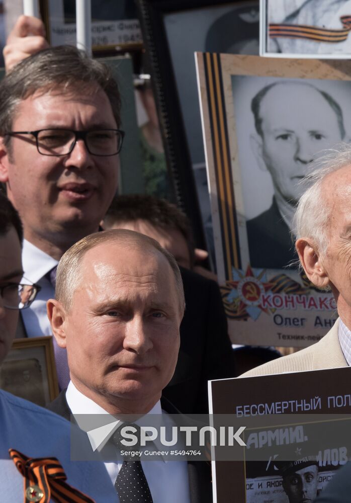 Russian President Vladimir Putin takes part in Immortal Regiment event