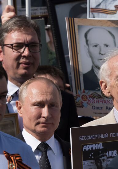 Russian President Vladimir Putin takes part in Immortal Regiment event