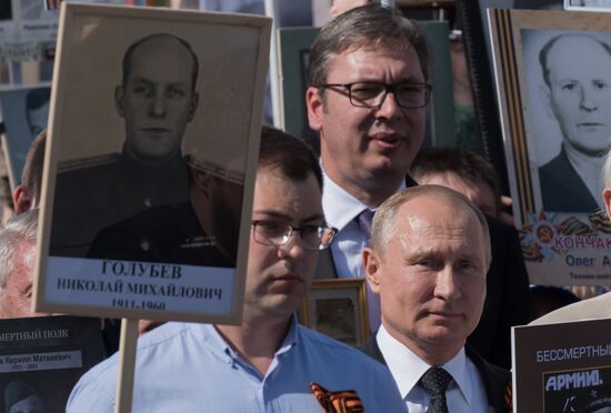 Russian President Vladimir Putin takes part in Immortal Regiment event