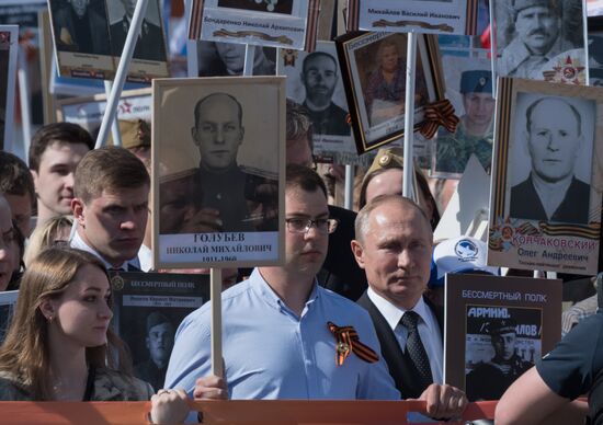 Russian President Vladimir Putin takes part in Immortal Regiment event