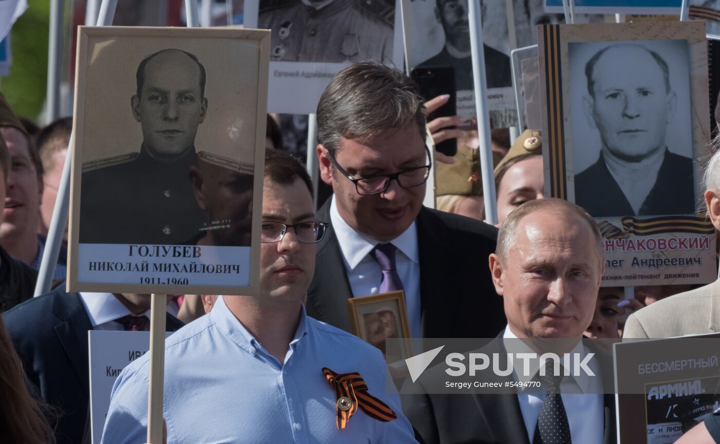 Russian President Vladimir Putin takes part in Immortal Regiment event