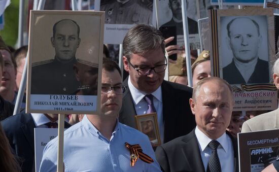 Russian President Vladimir Putin takes part in Immortal Regiment event
