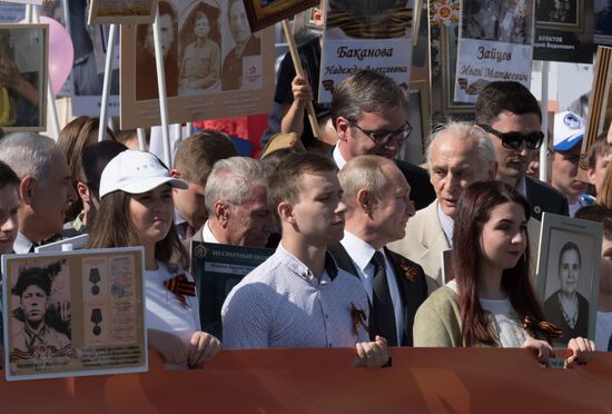 Russian President Vladimir Putin takes part in Immortal Regiment event