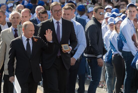 Russian President Vladimir Putin takes part in Immortal Regiment event